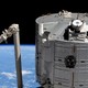 The SpaceX Crew Dragon seen during its approach to the ISS docking port, with the Kibo laboratory module in the foreground.